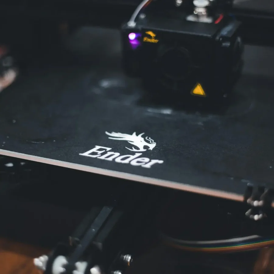 Detailed view of a 3D printer working on a design with the Ender brand logo visible.